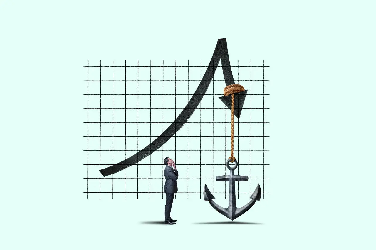 Un empresario observa el gráfico de tendencia bajista del mercado, lastrado por un ancla. Invierte en un mercado bajista.