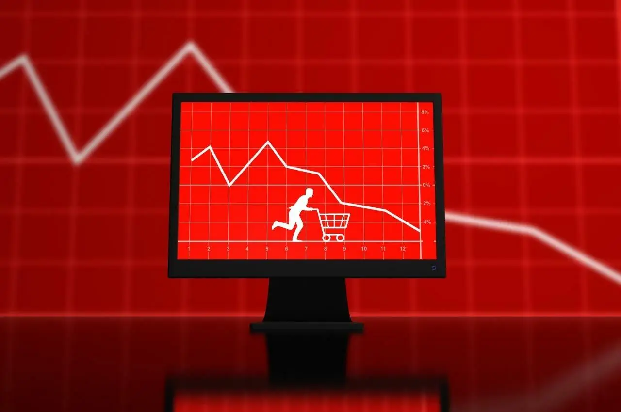 Gráfico que muestra la caída de las ventas en 2022; una persona tiene dificultades con el carrito de la compra. Invierta en 5 oportunidades durante la recesión.