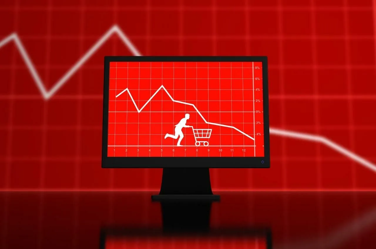 Gráfico que muestra la caída de las ventas en 2022; una persona tiene dificultades con el carrito de la compra. Invierta en 5 oportunidades durante la recesión.