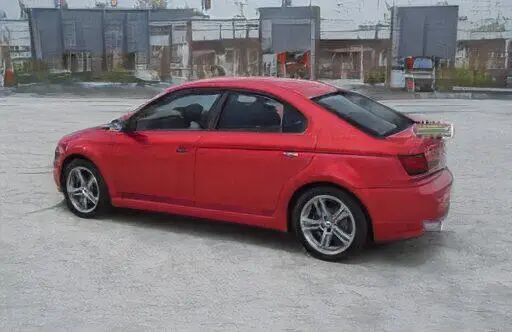 Sedán deportivo rojo estacionado en un lote vacío
